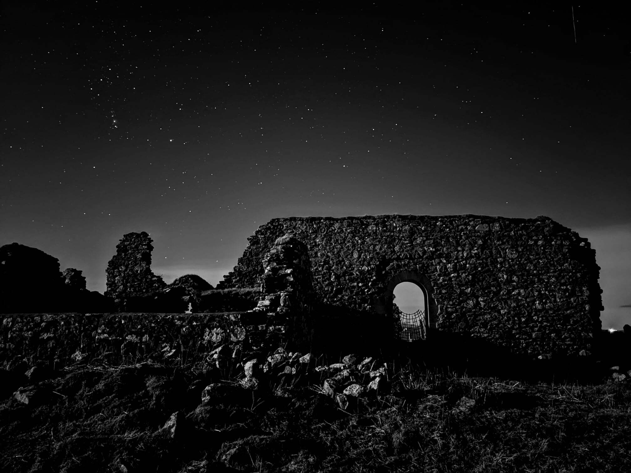 Night sky photography on Uist featuring a delapidated stone building